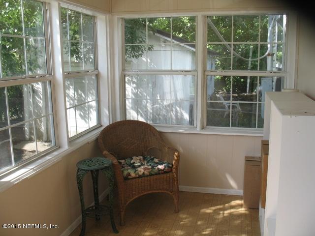 4834 Dundee Road Jacksonville, FL 32210 - Photo 4 of 28 a living room filled with furniture