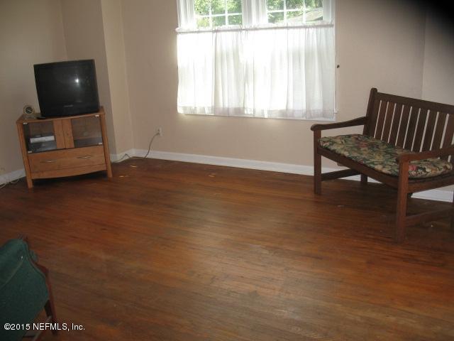 4834 Dundee Road Jacksonville, FL 32210 - Photo 5 of 28 a living room with furniture and a window