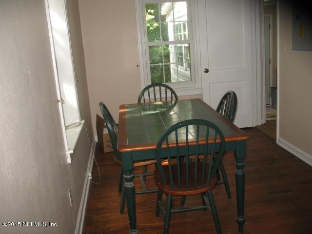 4834 Dundee Road Jacksonville, FL 32210 - Photo 10 of 28 a view of a dining room with furniture window and wooden floor