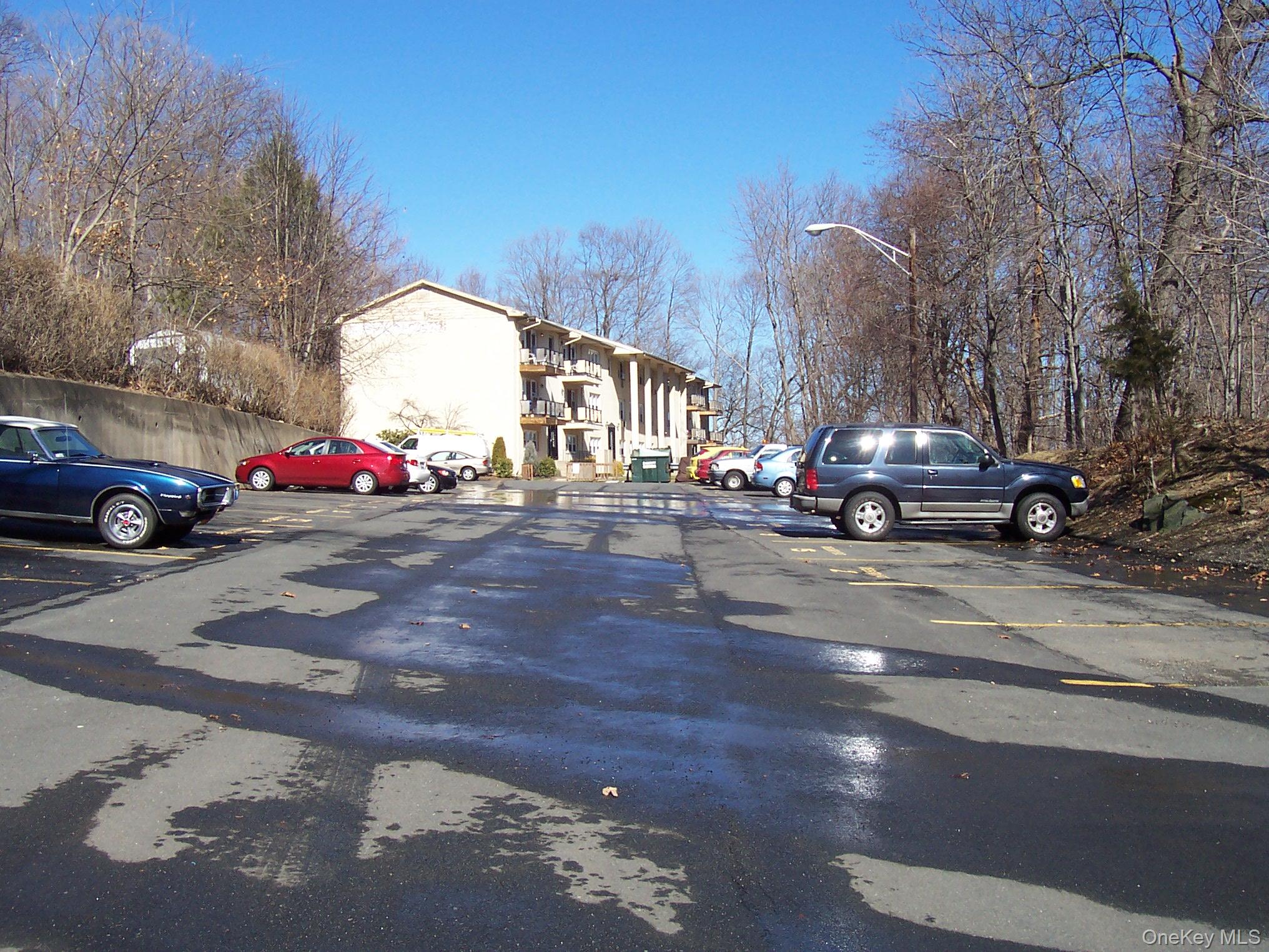 21 Pavilion Road, Unit 6 Suffern, NY 10901 - Photo 2 of 8 a cars parked on the side of a street