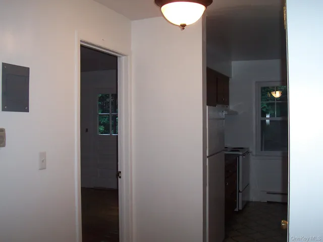 a view of a bathroom from a hallway