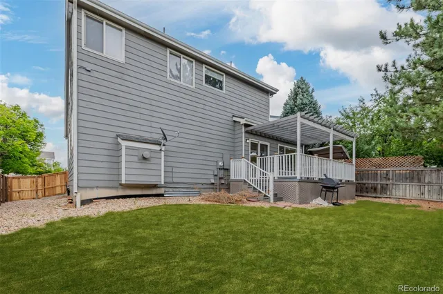 a front view of house with a garden