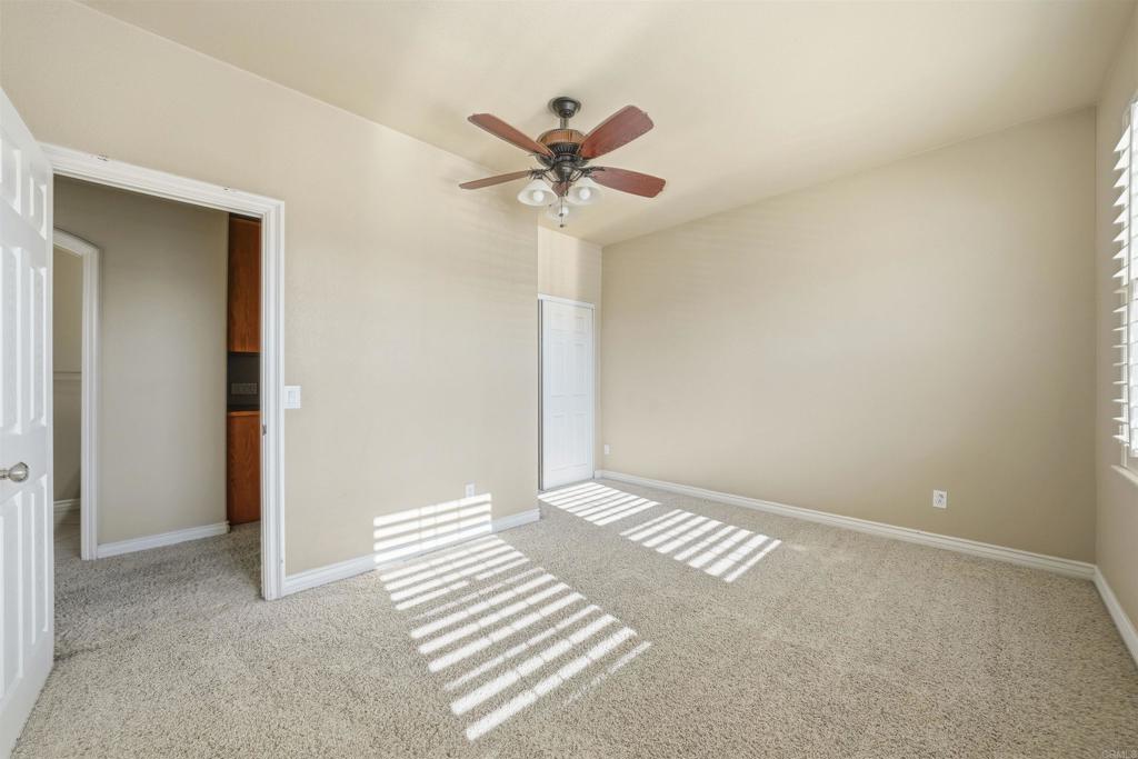 2612 Coyote Ridge Terrace Chula Vista, CA 91915 - Photo 35 of 57 a view of a livingroom with a ceiling fan and window