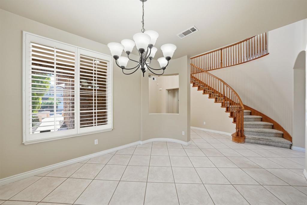 2612 Coyote Ridge Terrace Chula Vista, CA 91915 - Photo 8 of 57 a view of an room with wooden floor and windows