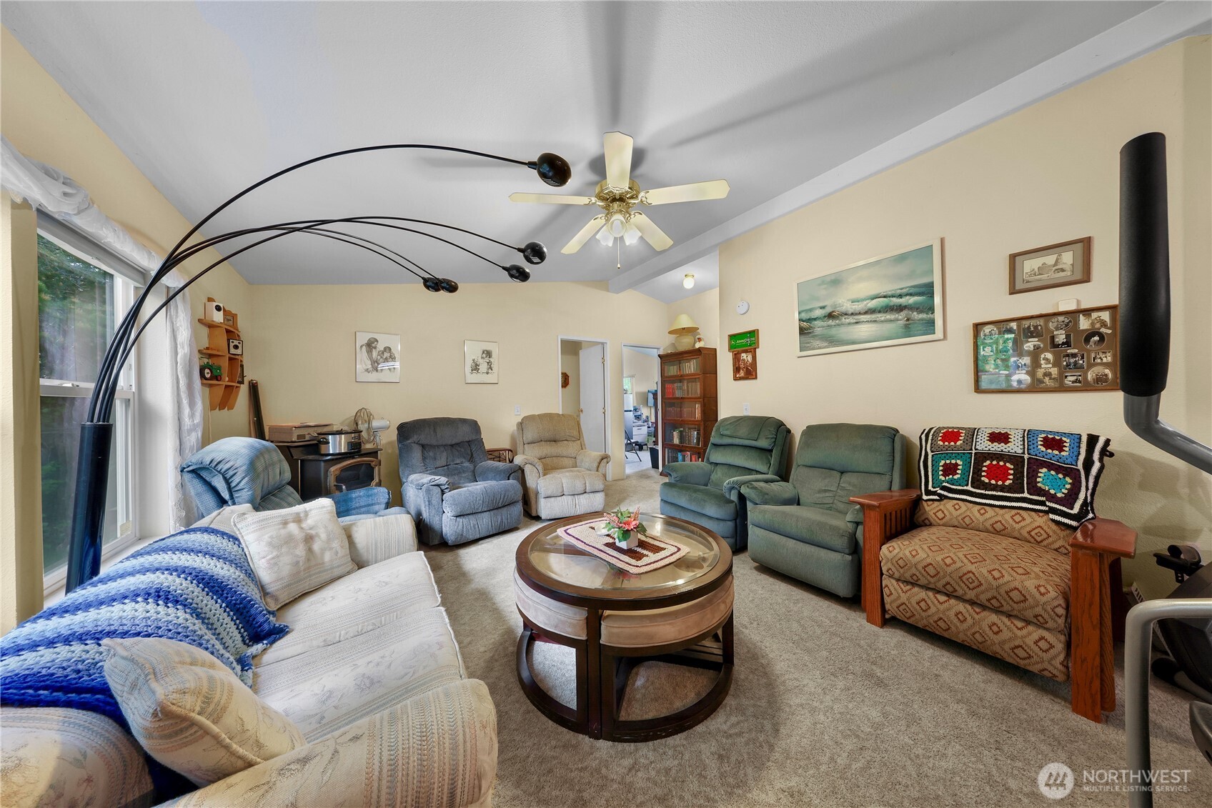 7928 Portal Way Custer, WA 98240 - Photo 12 of 39 a living room with furniture a fireplace and a chandelier