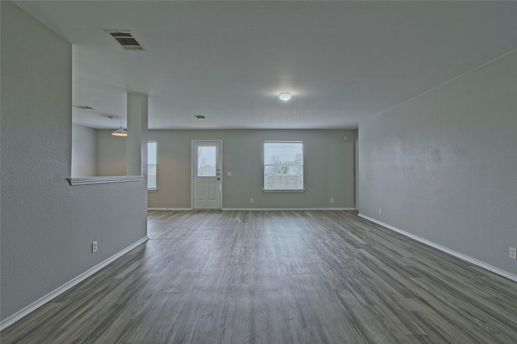 232 Brickyard Lane Jarrell, TX 76537 - Photo 31 of 31 The open floorplan features new flooring and natural light.