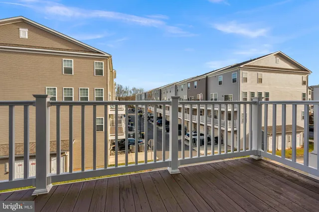 a view of a wooden deck and city view