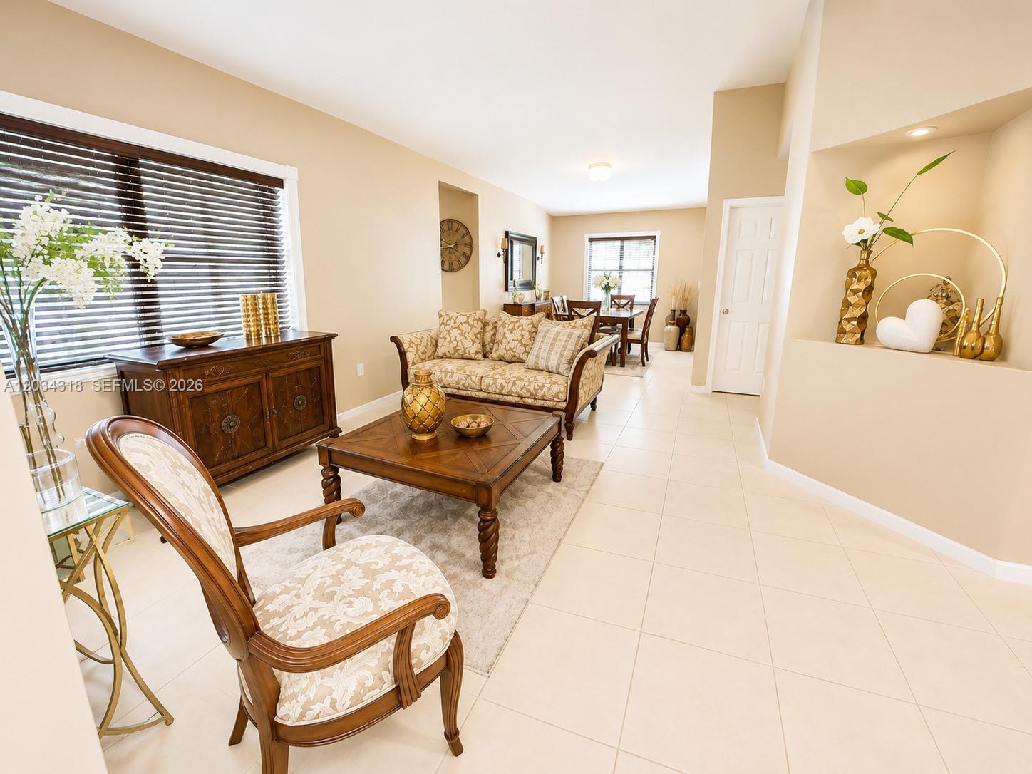 14856 Southwest 179th Street Miami, FL 33187 - Photo 6 of 33 a living room with furniture and a window