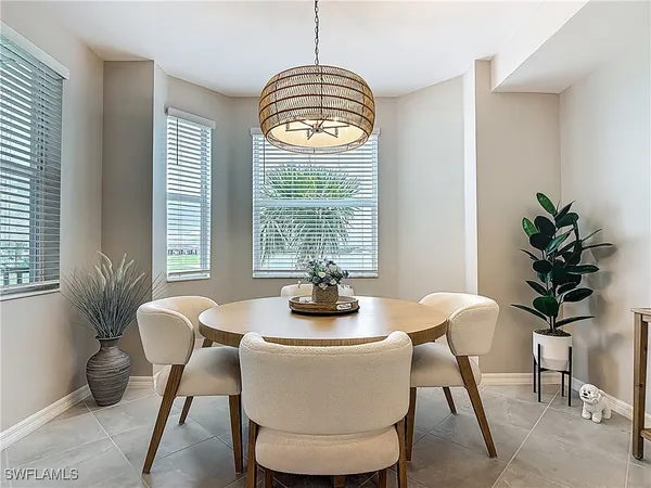 a view of a dining room with furniture window and chandelier