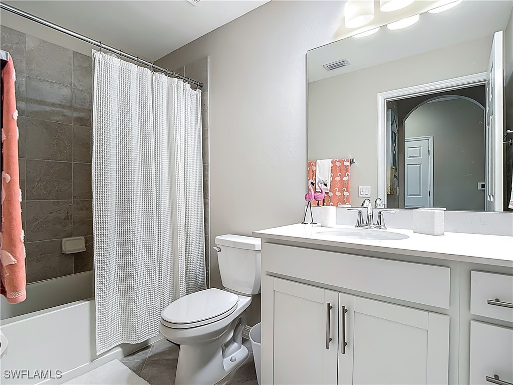 43981 Boardwalk Loop, Unit 2222 Punta Gorda, FL 33982 - Photo 23 of 50 a bathroom with a sink a toilet and shower