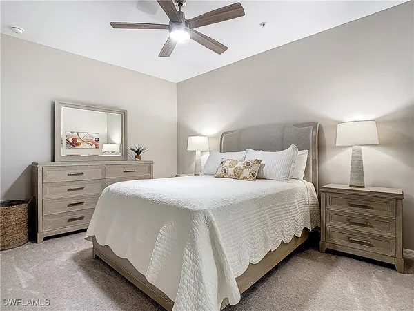 a bedroom with bed and a couch