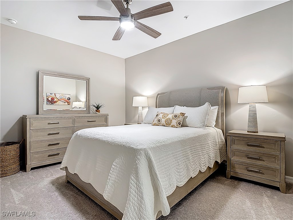 43981 Boardwalk Loop, Unit 2222 Punta Gorda, FL 33982 - Photo 25 of 50 a bedroom with a bed and a dresser