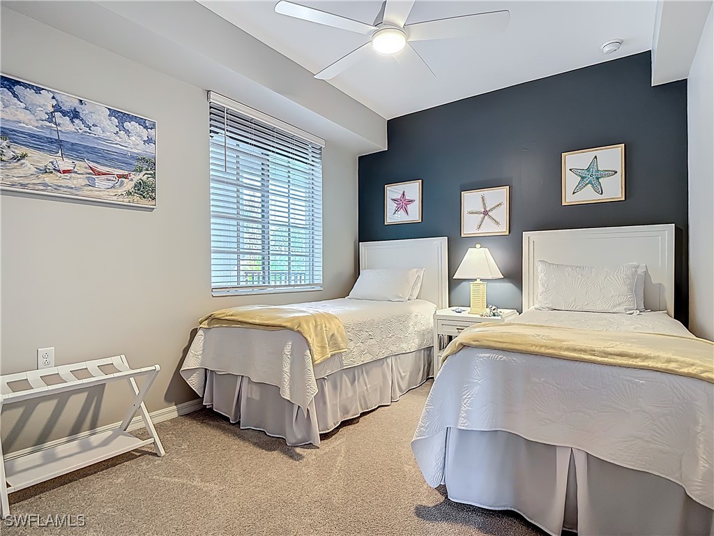 43981 Boardwalk Loop, Unit 2222 Punta Gorda, FL 33982 - Photo 26 of 50 a bedroom with bed and a couch