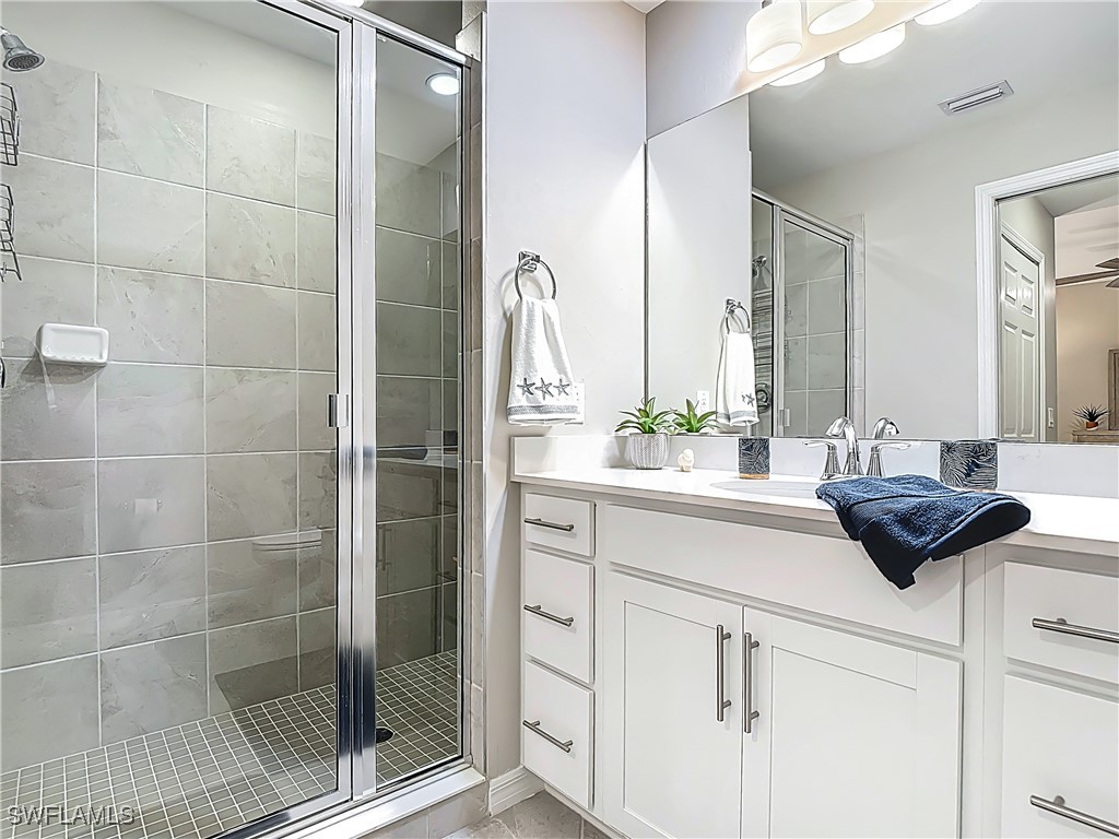 43981 Boardwalk Loop, Unit 2222 Punta Gorda, FL 33982 - Photo 28 of 50 a bathroom with a sink and a mirror