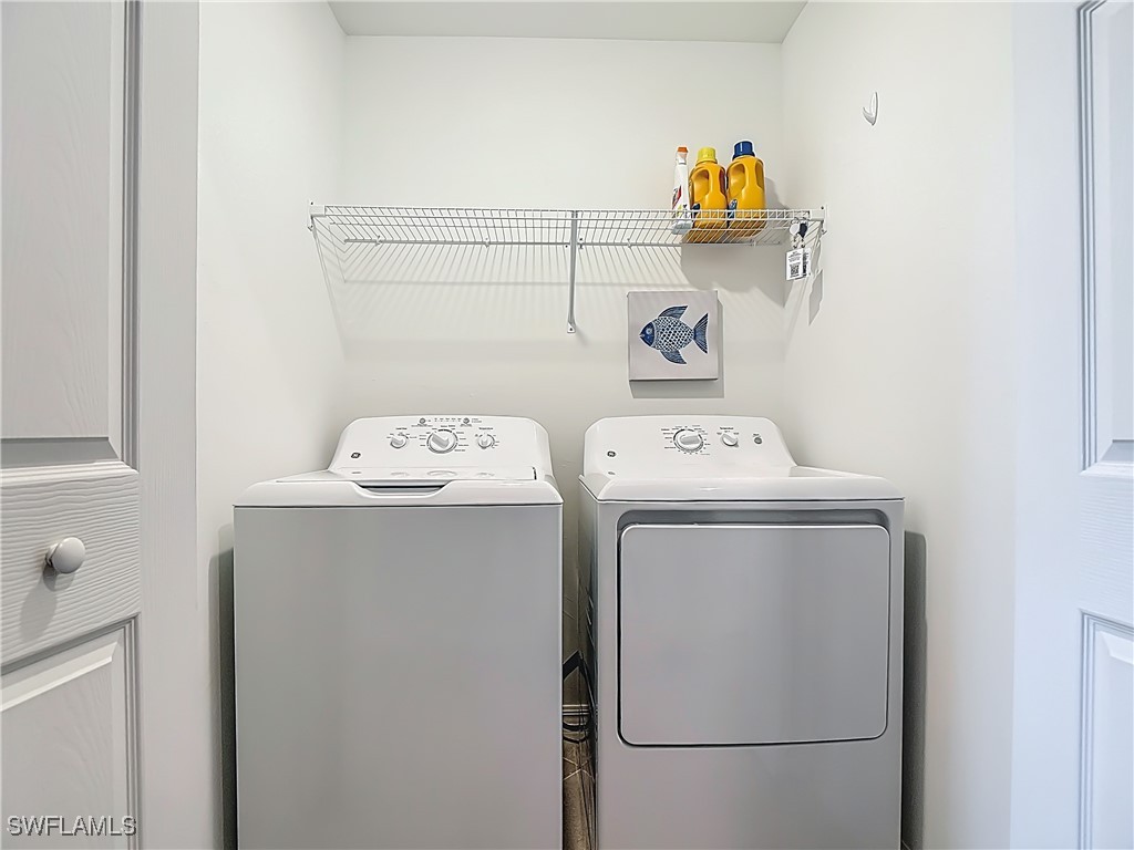 43981 Boardwalk Loop, Unit 2222 Punta Gorda, FL 33982 - Photo 29 of 50 a utility room with dryer and washer