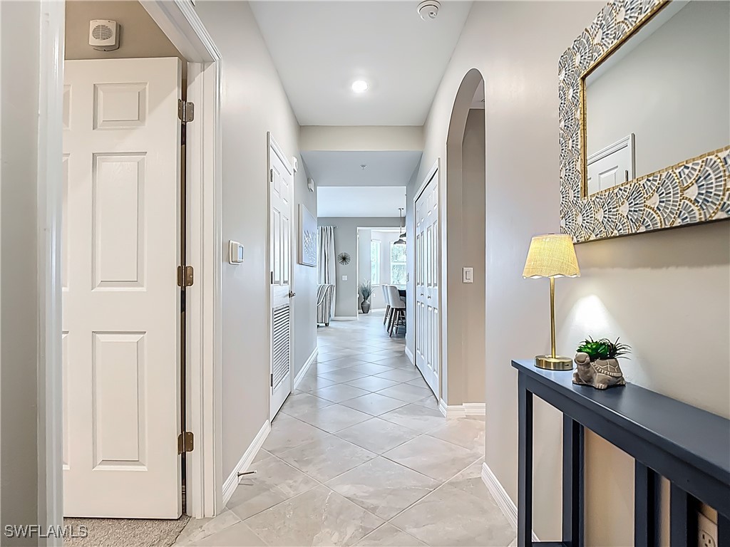 43981 Boardwalk Loop, Unit 2222 Punta Gorda, FL 33982 - Photo 3 of 50 a view of a hallway to a livingroom with furniture