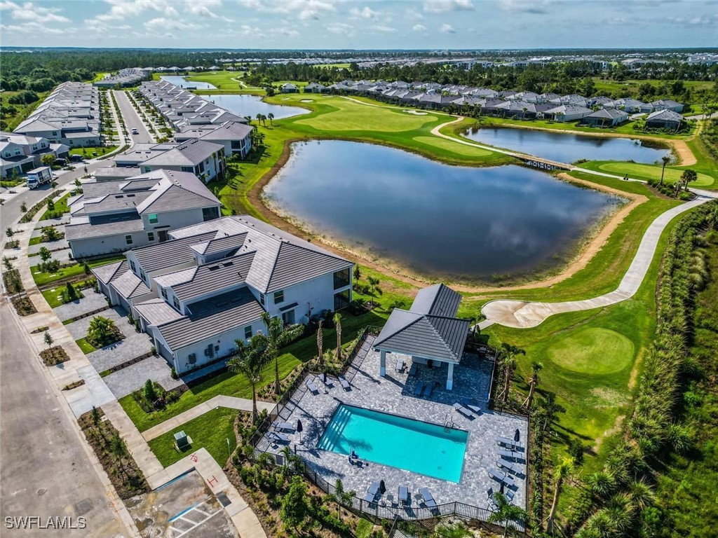 43981 Boardwalk Loop, Unit 2222 Punta Gorda, FL 33982 - Photo 42 of 50 an aerial view of a house with a swimming pool yard and outdoor seating