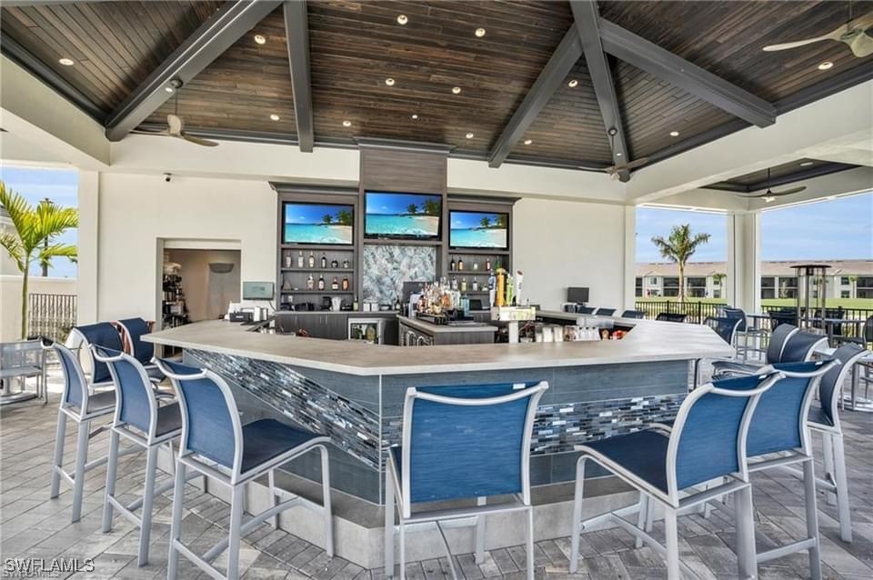 43981 Boardwalk Loop, Unit 2222 Punta Gorda, FL 33982 - Photo 44 of 50 a dining table with chairs and chandelier