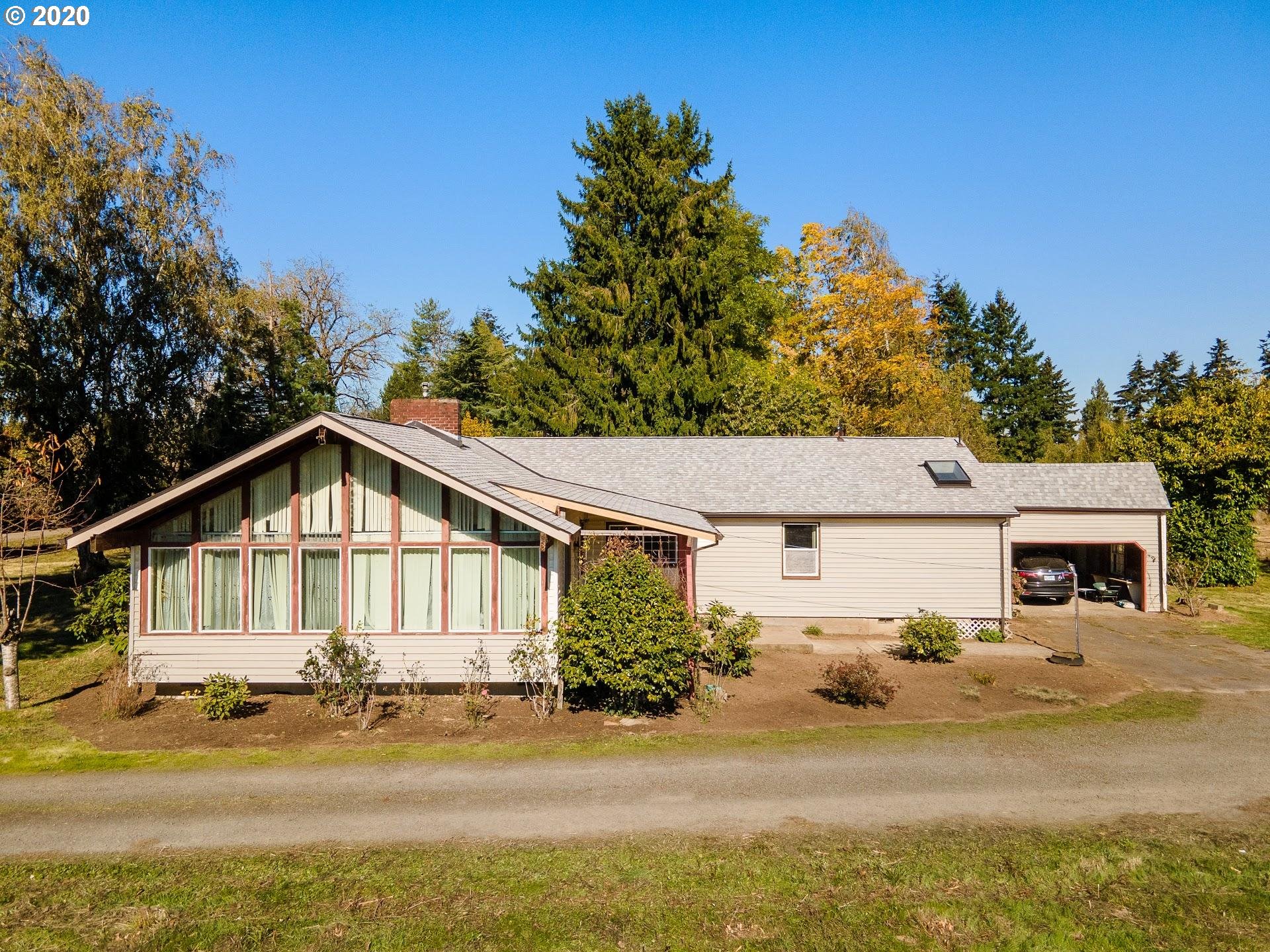 7110 Southwest Straughan Road Hillsboro, OR 97123 - Photo 16 of 28 a view of a house with a big yard