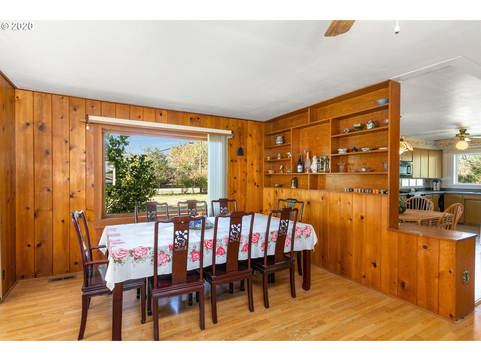 7110 Southwest Straughan Road Hillsboro, OR 97123 - Photo 6 of 28 a view of a dining room with furniture window and outside view