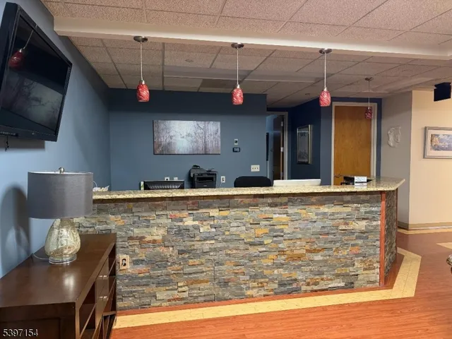 a view of a living room with a flat screen tv