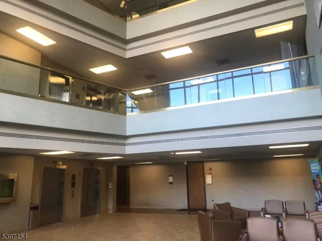 a view of a hallway with seating area