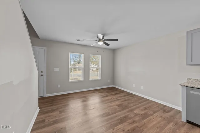 a view of an empty room with a window