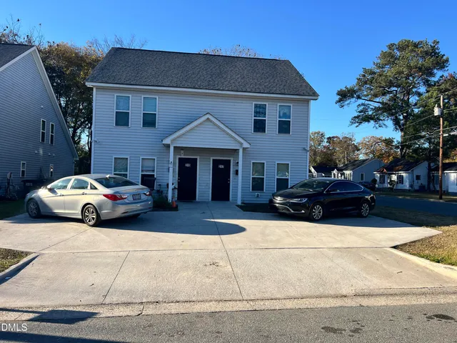 a car parked in front of a house
