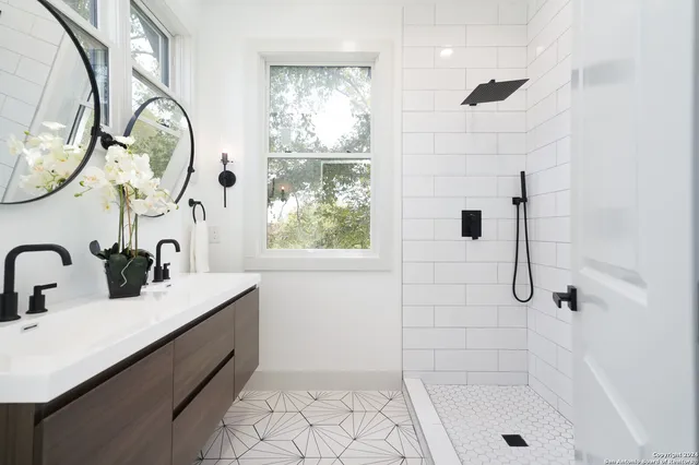 a bathroom with a sink and a mirror