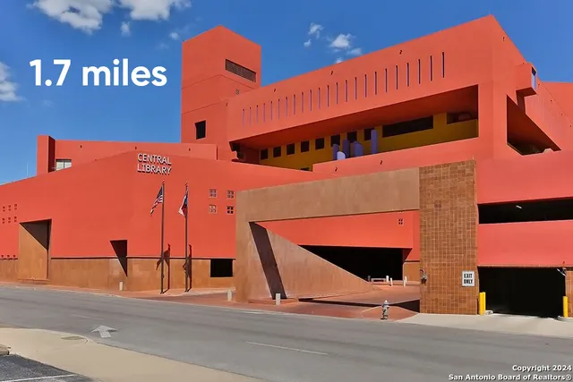 a view of swimming pool with outdoor seating and plants