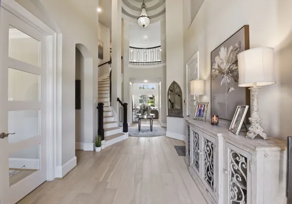 a view of entryway livingroom and hall with wooden floor