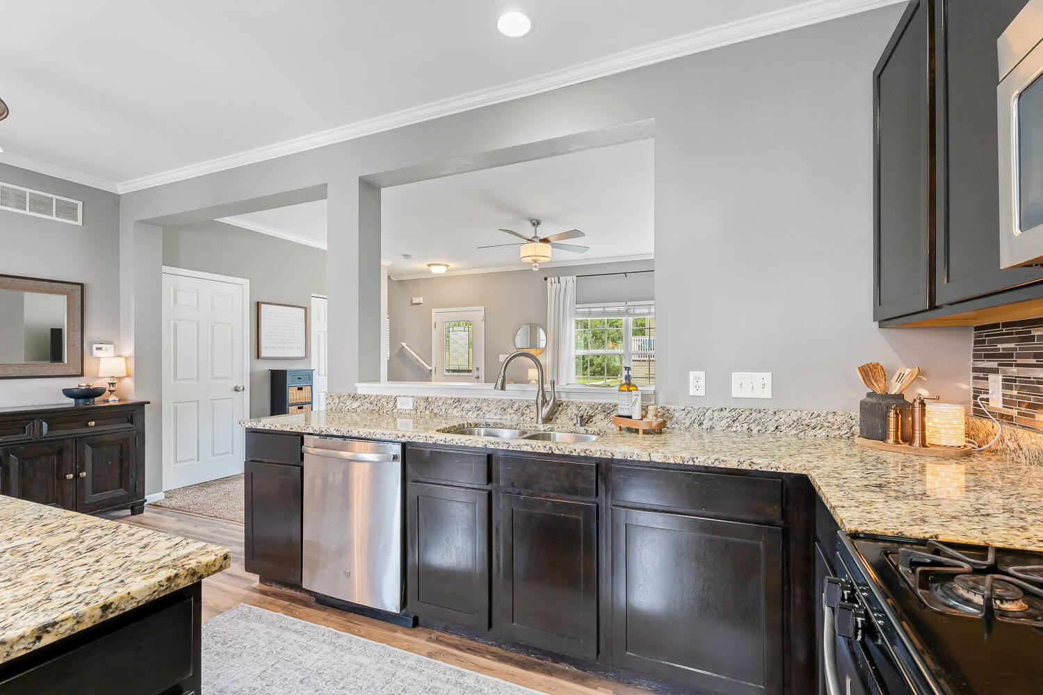 2725 West 127th Lane Crown Point, IN 46307 - Photo 18 of 51 a kitchen with granite countertop stainless steel appliances and sink