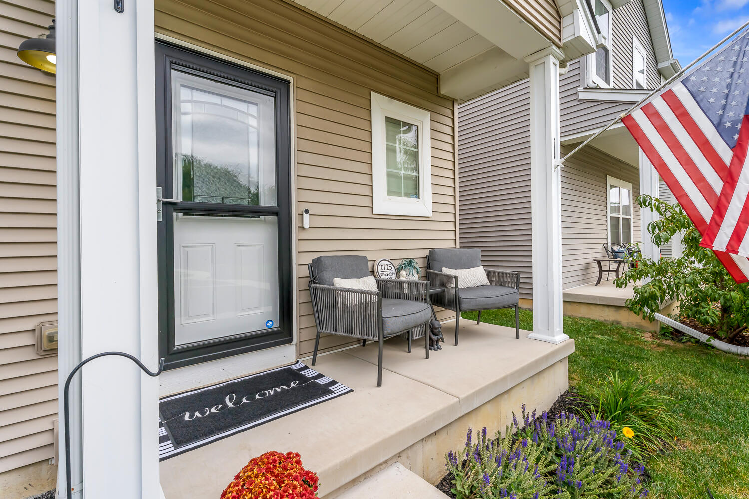 2725 West 127th Lane Crown Point, IN 46307 - Photo 2 of 51 a patio with table and chairs and potted plants