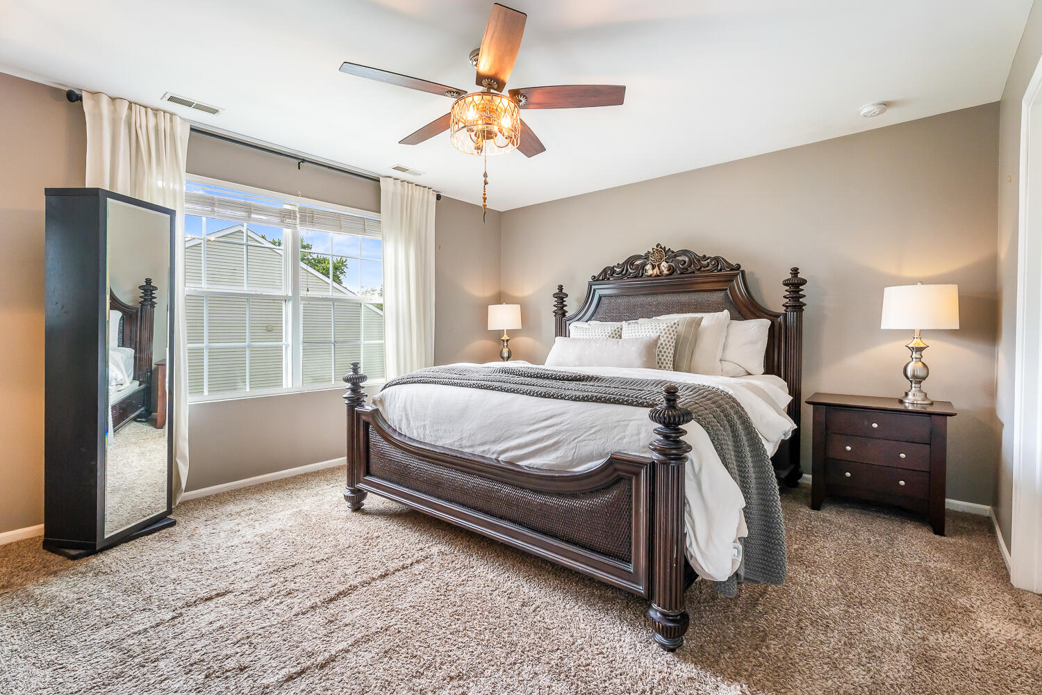 2725 West 127th Lane Crown Point, IN 46307 - Photo 22 of 51 a bedroom with a bed and a chandelier