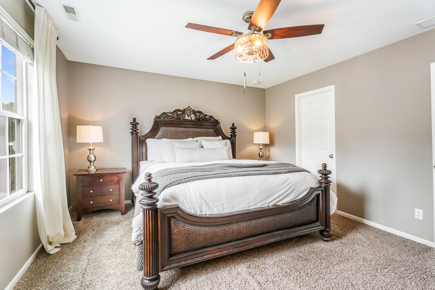 2725 West 127th Lane Crown Point, IN 46307 - Photo 23 of 51 a bedroom with a bed and a chandelier