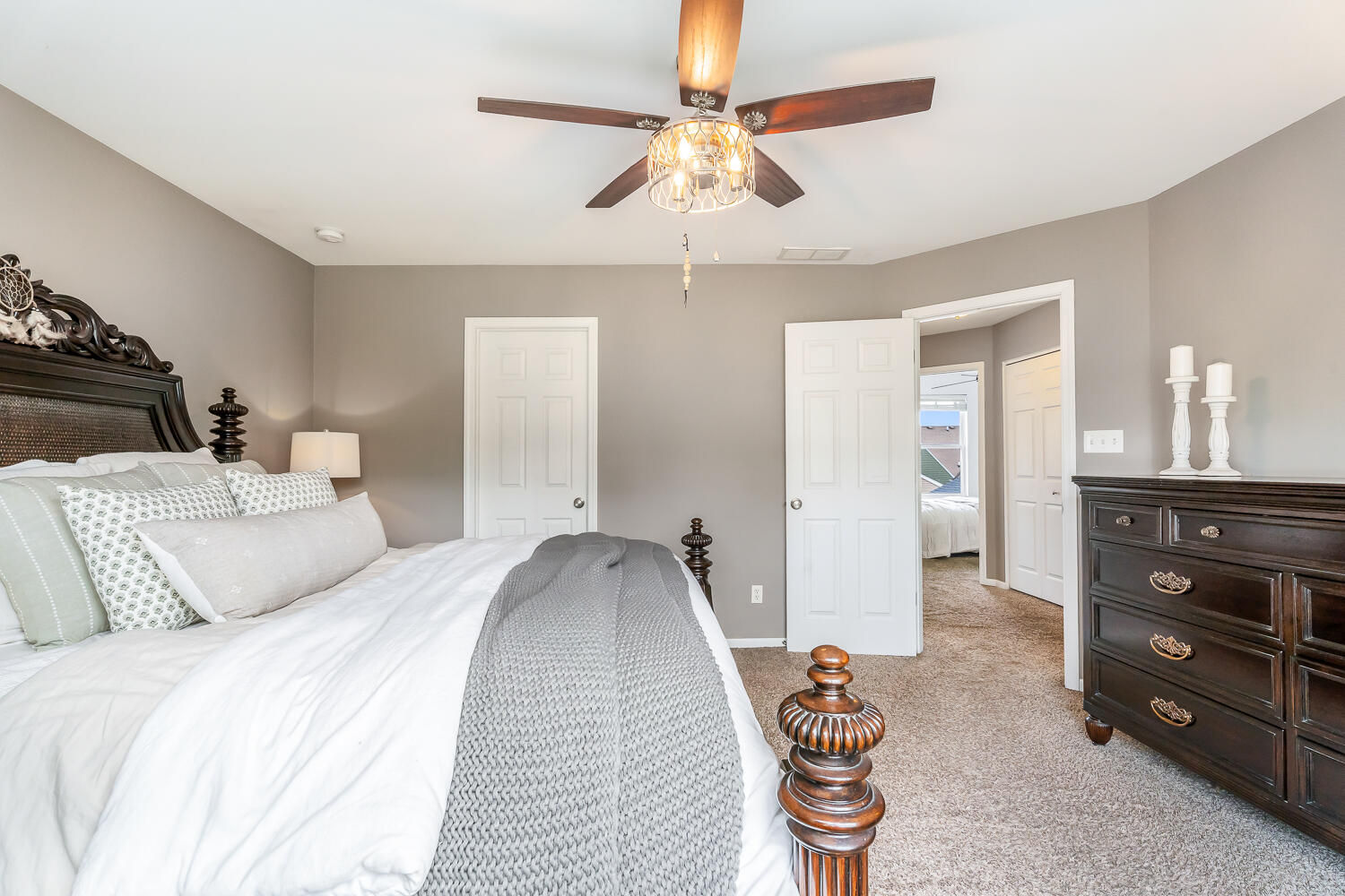 2725 West 127th Lane Crown Point, IN 46307 - Photo 24 of 51 a bedroom with a bed and a chandelier