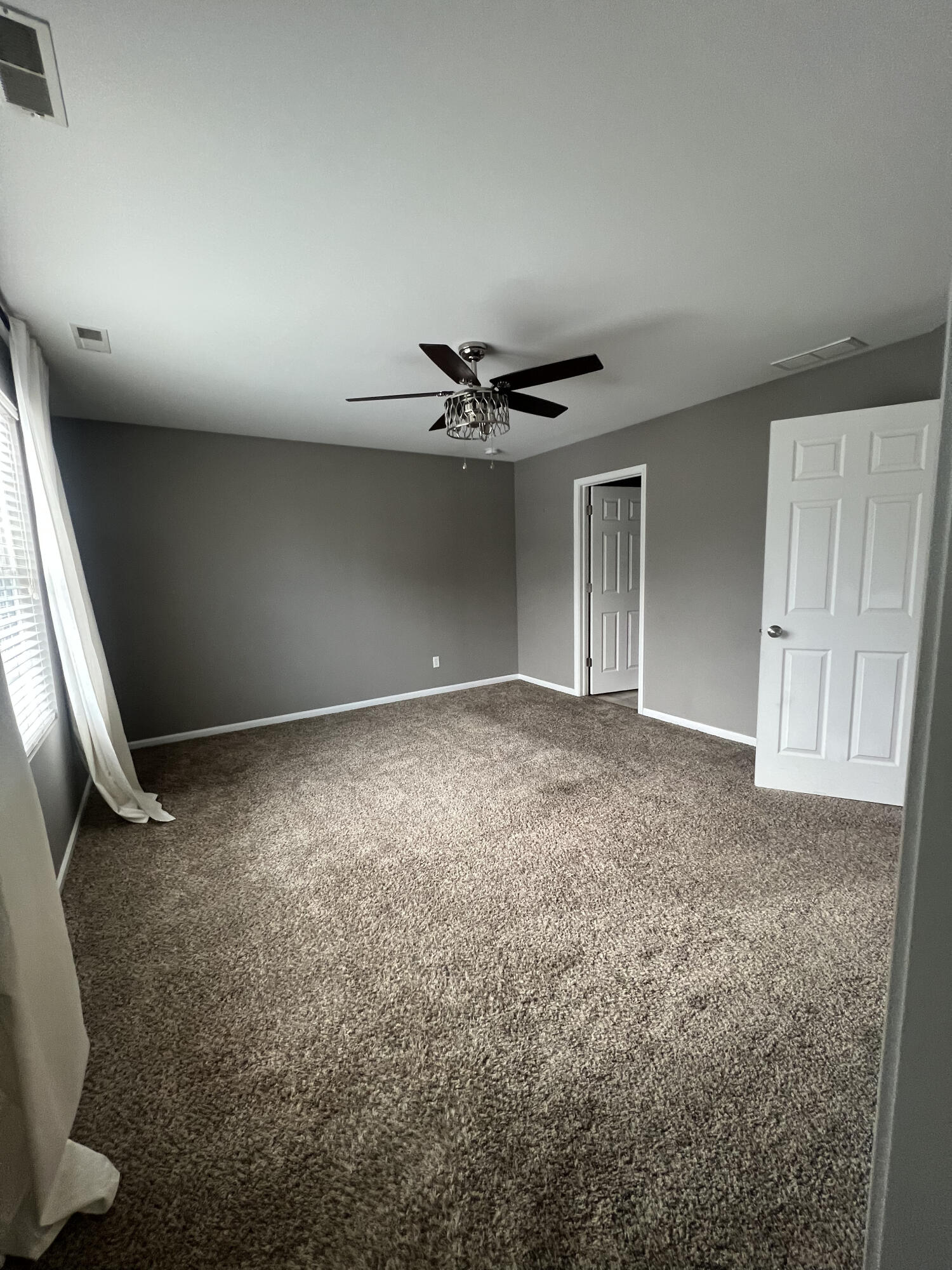 2725 West 127th Lane Crown Point, IN 46307 - Photo 26 of 51 an empty room with a ceiling fan and window