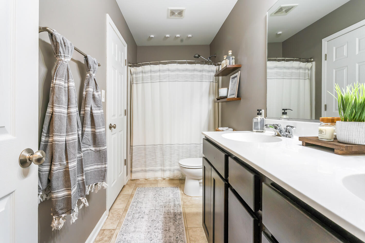 2725 West 127th Lane Crown Point, IN 46307 - Photo 28 of 51 a spacious bathroom with a shower sink and a mirror