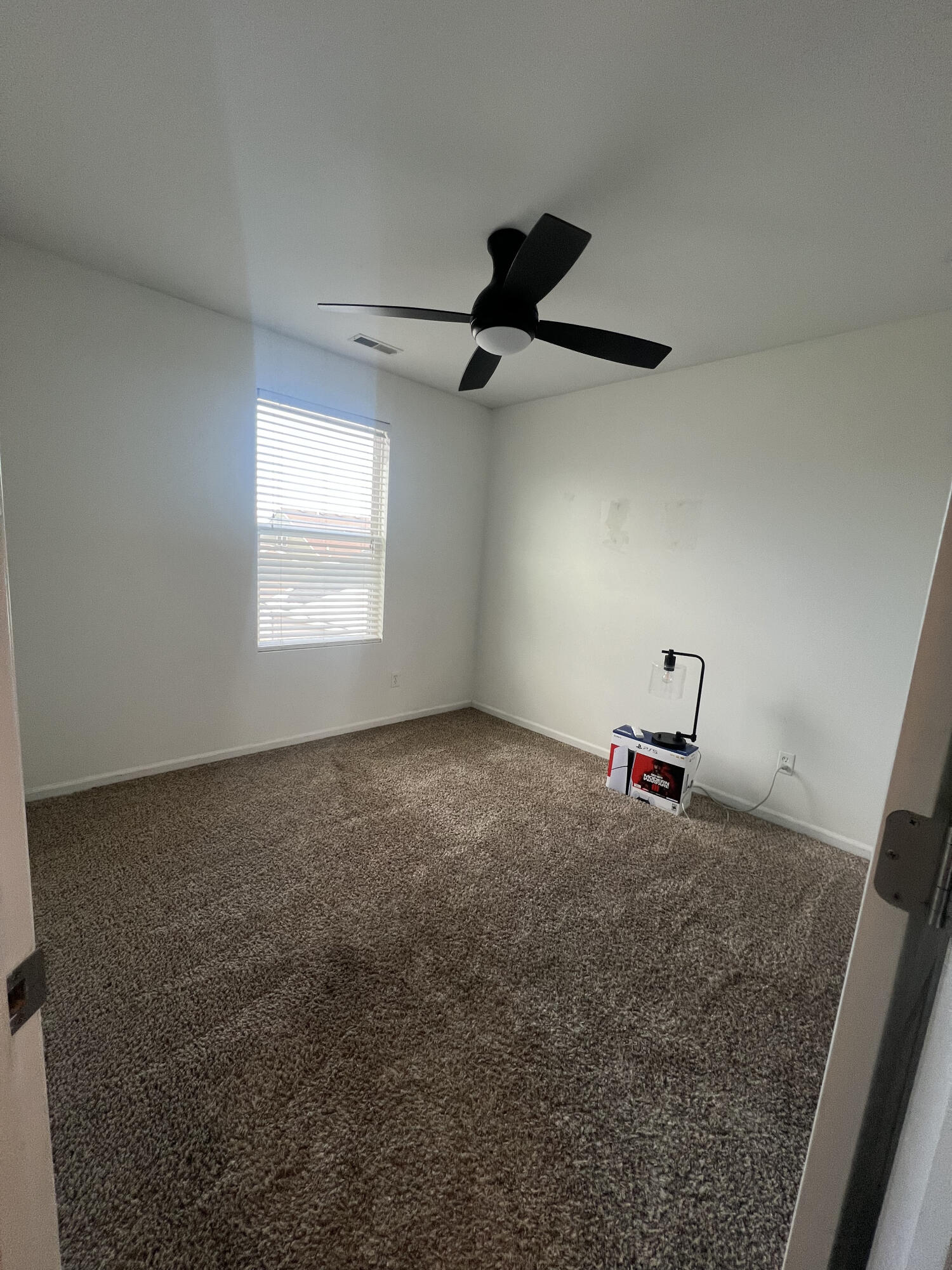 2725 West 127th Lane Crown Point, IN 46307 - Photo 37 of 51 a view of a room with a ceiling fan and window