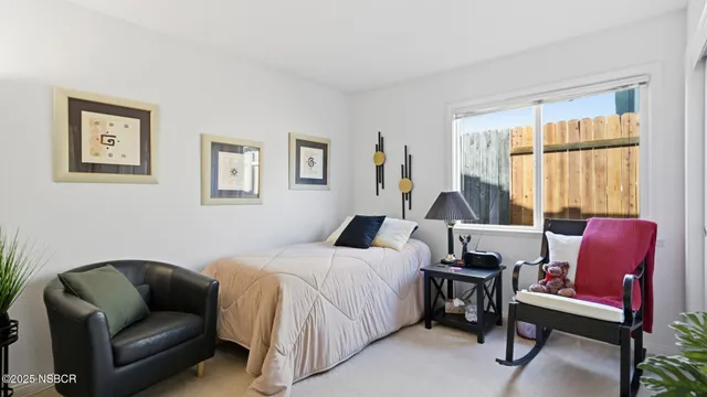 a bedroom with a bed and a couch