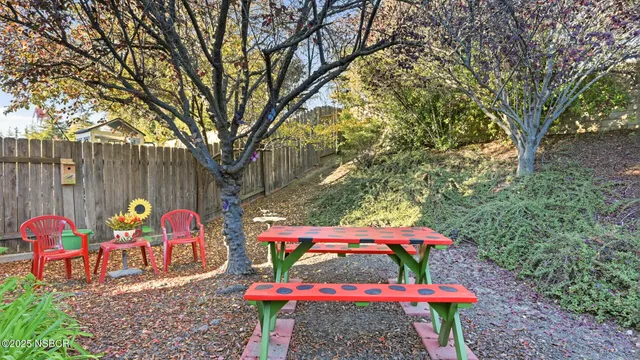 an outdoor space with chairs and table
