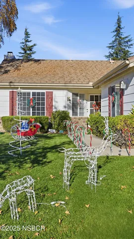 a front view of house with an outdoor seating