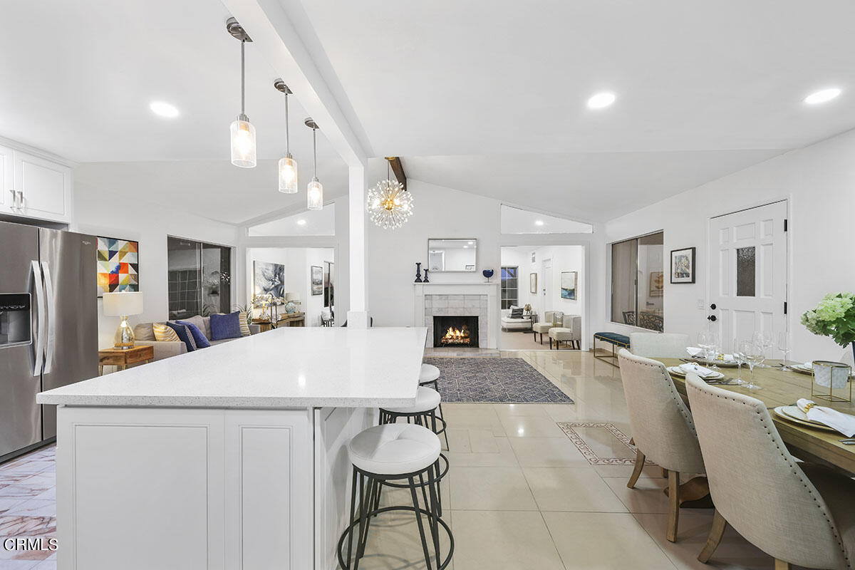 10842 Owens Place Tujunga, CA 91042 - Photo 13 of 68 a living room with furniture a fireplace and a table
