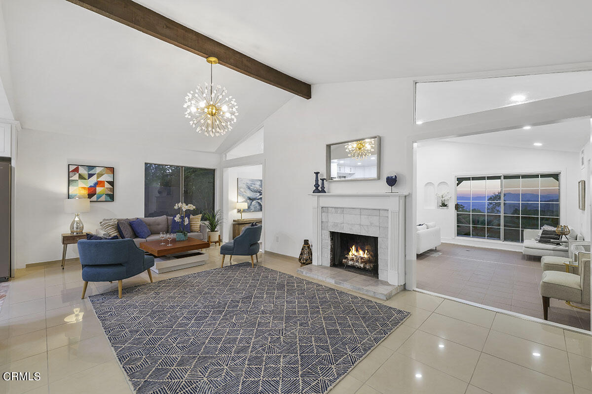 10842 Owens Place Tujunga, CA 91042 - Photo 2 of 68 a living room with furniture and a fireplace