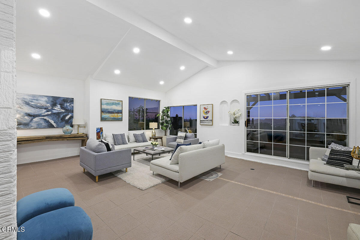 10842 Owens Place Tujunga, CA 91042 - Photo 23 of 68 a living room with furniture and a large window