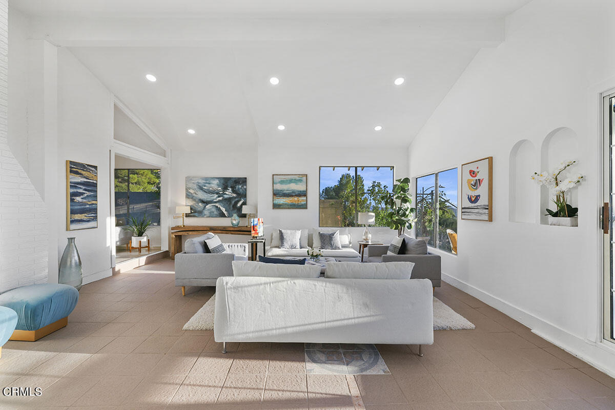 10842 Owens Place Tujunga, CA 91042 - Photo 25 of 68 a living room with fireplace furniture and a large window