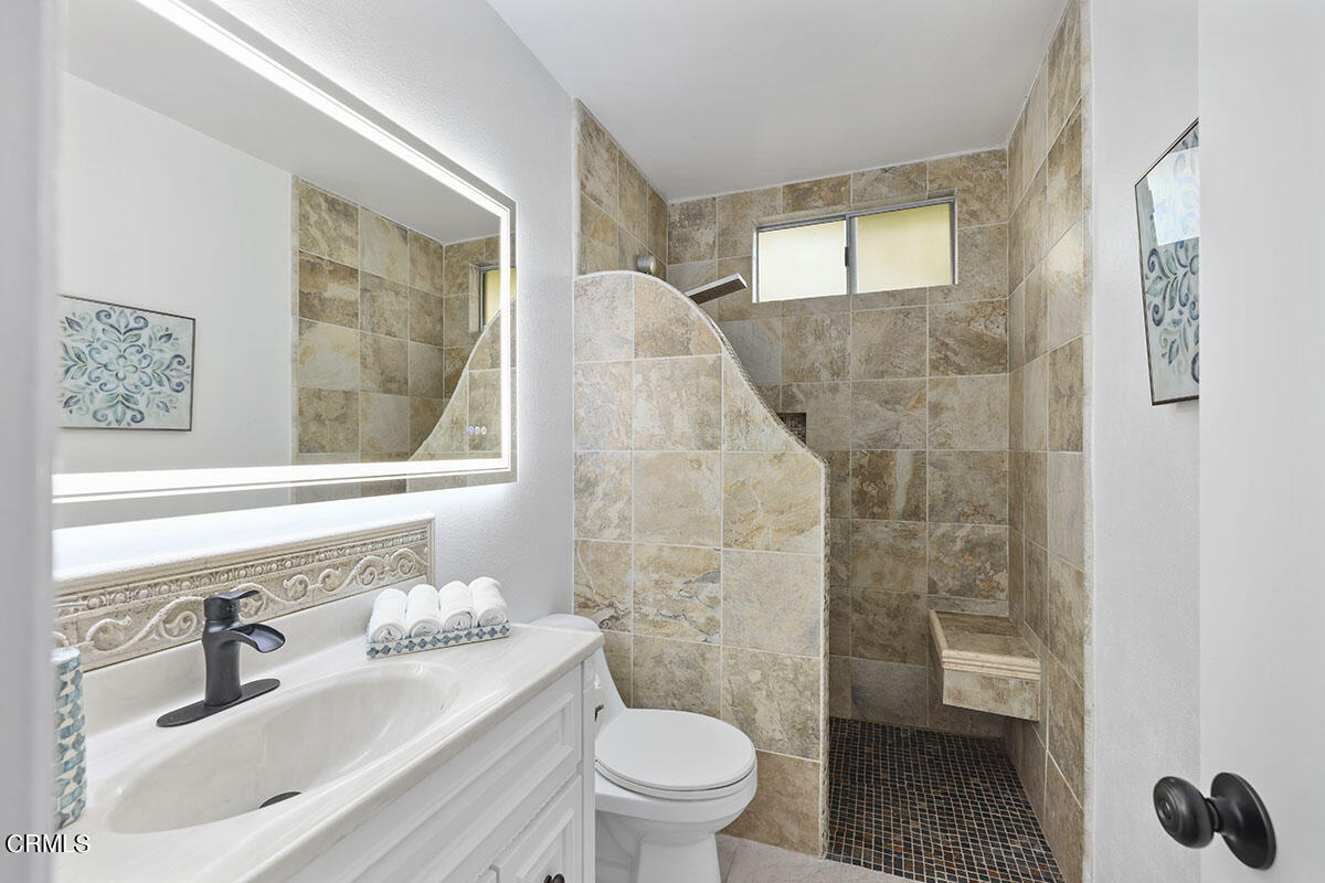 10842 Owens Place Tujunga, CA 91042 - Photo 27 of 68 a bathroom with a sink toilet and shower