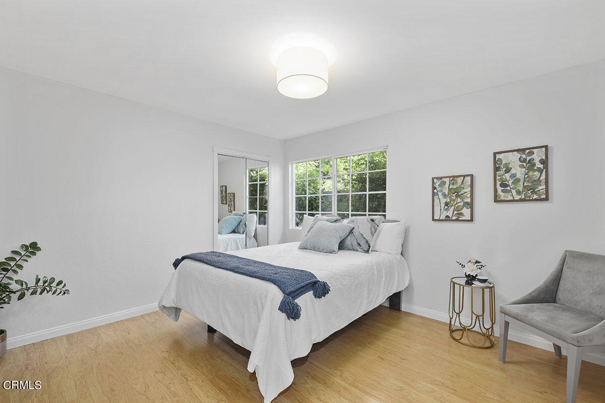 10842 Owens Place Tujunga, CA 91042 - Photo 32 of 68 a bedroom with a bed and a couch