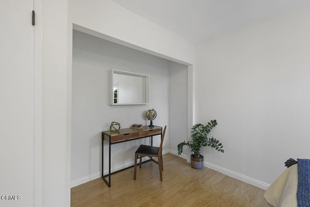 10842 Owens Place Tujunga, CA 91042 - Photo 35 of 68 a room with a table and a potted plant