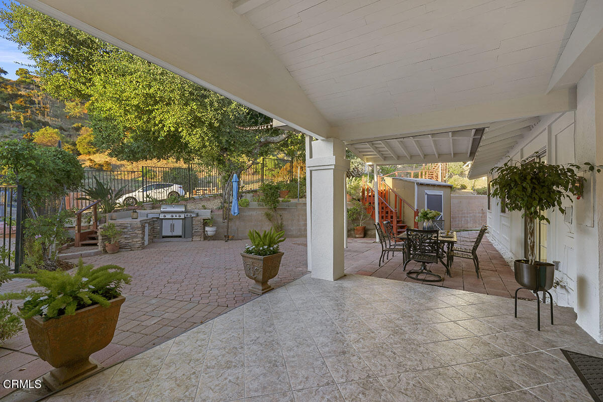 10842 Owens Place Tujunga, CA 91042 - Photo 45 of 68 a view of a chairs and table in a patio